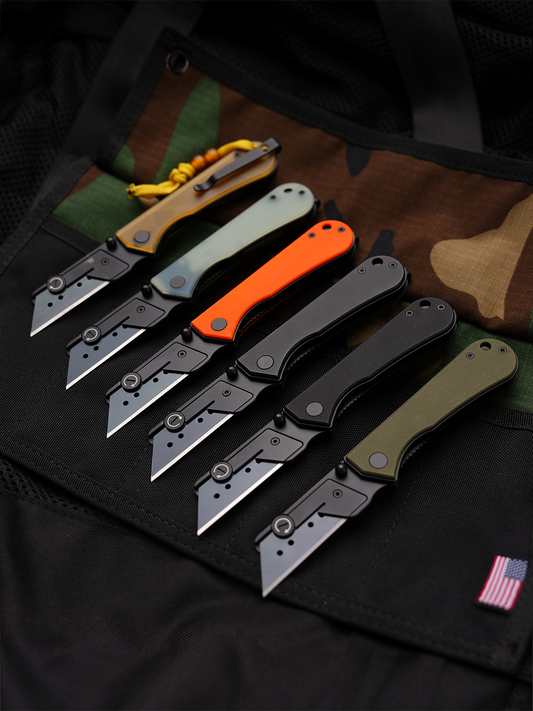 U23 Gen 2 black blade folding utility knives in different handle colors displayed in a lifestyle setting